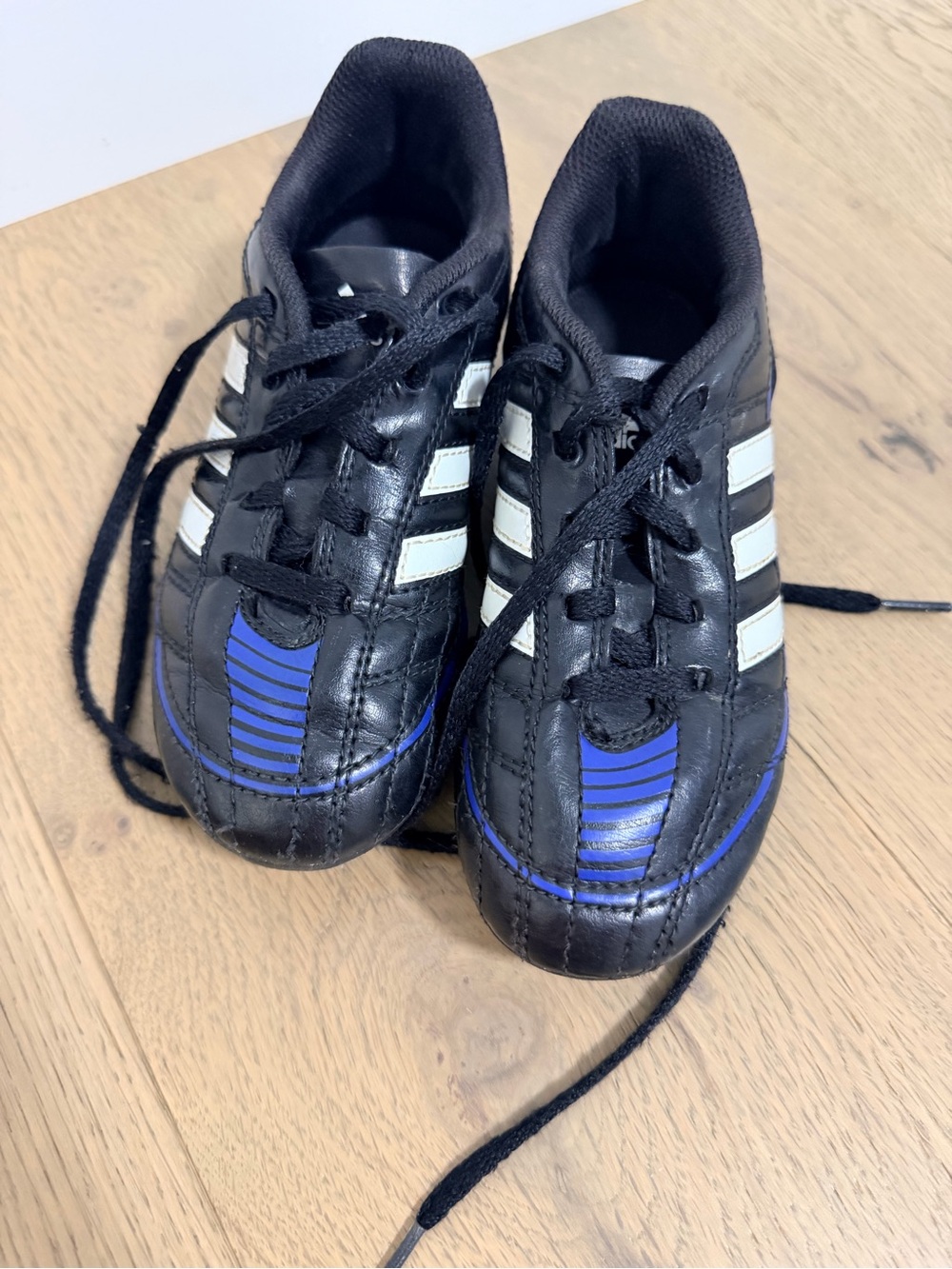 adidas Kids Black Sneakers with White Stripes and Blue Accents